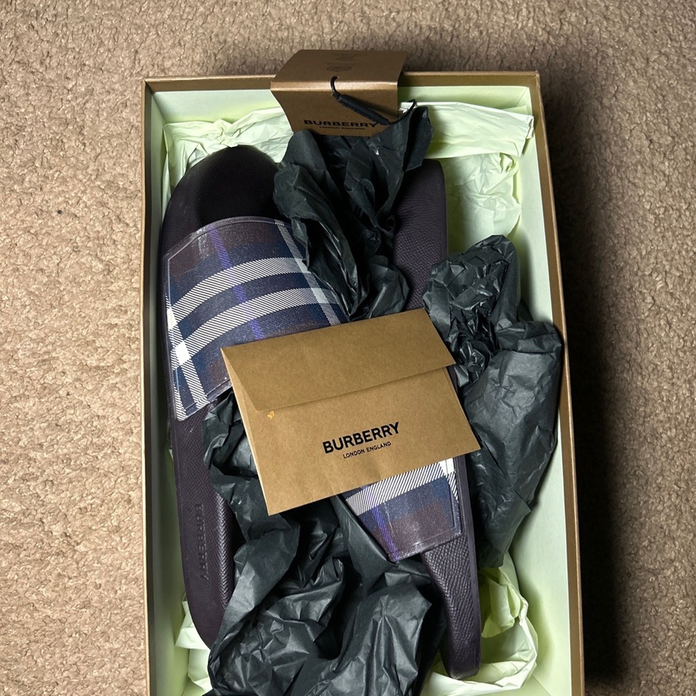 Used Burberry slides, minor scratches, proven authenticity